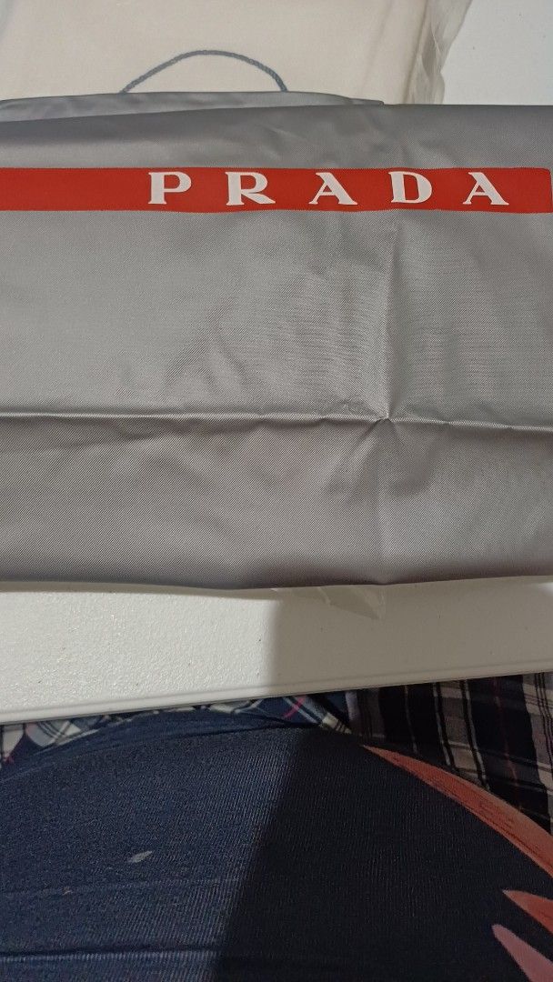 Prada Dustbag (Category: Luxury Bags & Wallets) located in Rizal. Submitted by jekomy (Listing ID 1445876844, Image 2). Description: - Authentic Prada dustbag - Material: PVC cloth - Condition: Like new - Features: Includes original label inside - Dimensions: 15 inches height x 15 inches width.