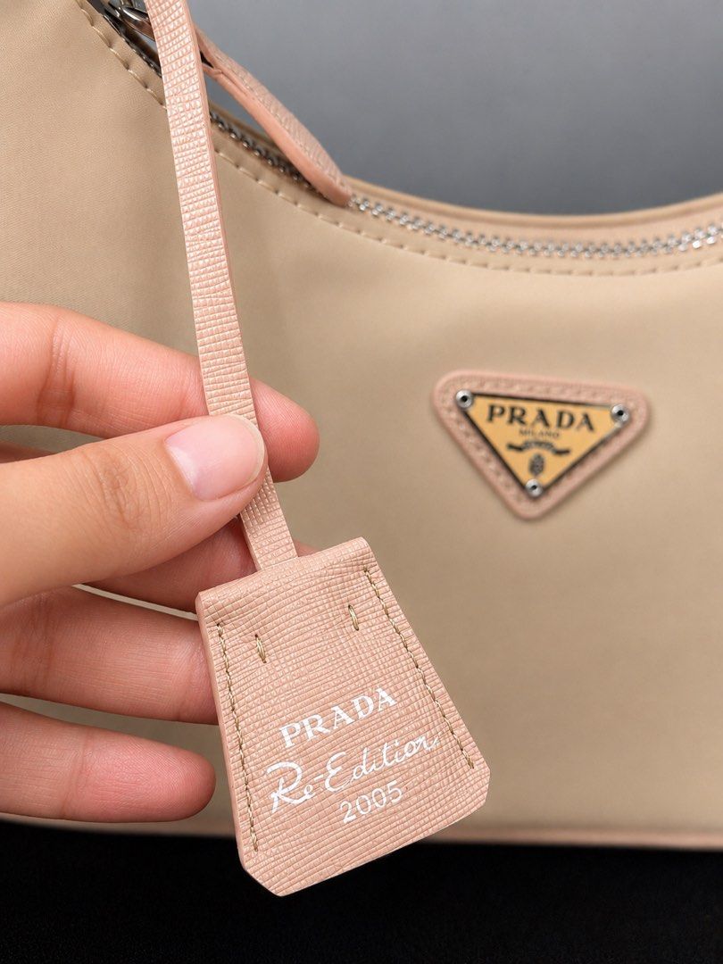 Prada Re-Edition 2005 Re-Nylon mini bag, (Category: Luxury Bags & Wallets) located in San Pedro. Submitted by tinkerkidsph (Listing ID 1445910726, Image 3). Description: Prada Re-Edition 2005 Re-Nylon mini bag - Material: Safiano leather - Color: Desert Beige - Strap & Trim: Desert Beige - Interior: Clean - Includes: Prada Tag - Ideal for: Everyday use Japan sourced. Bought in japan thrift shop Rfs: need funds for school.