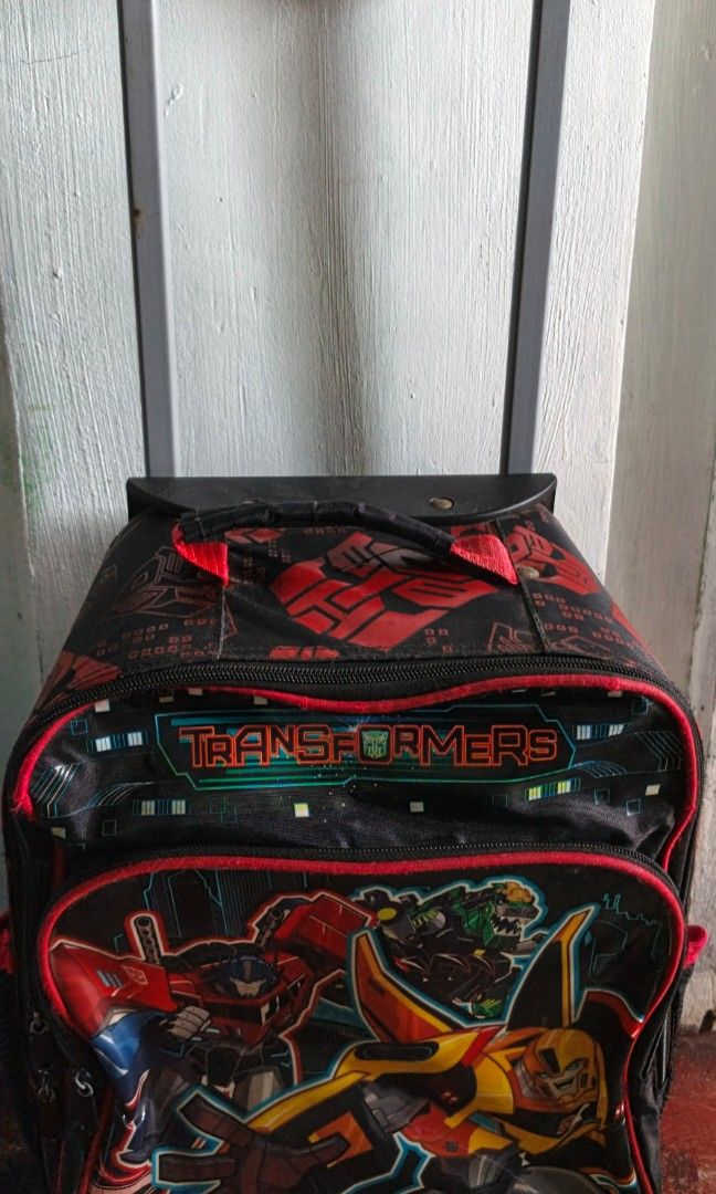 Preloved Transformer Trolley School Bag (Category: Babies & Kids Fashion) located in Caloocan City. Submitted by ayzer_18 (Listing ID 1445818577, Image 2). Description: Pre-loved/Used. Has minor signs of use but still very functional, intact zippers, and ready for school use. Please refer to photos for actual condition..