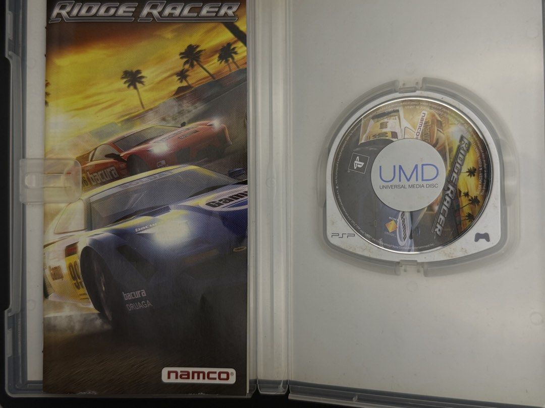 PSP Ridge Racer UMD Game (Category: PlayStation) located in Las Pinas. Submitted by cjdmc (Listing ID 1445856847, Image 3). Description: - Ridge Racer for PSP - Includes UMD disc and original case - Classic, fast-paced racing action - Features cool cars - Perfect for PSP owners seeking a retro racing experience.