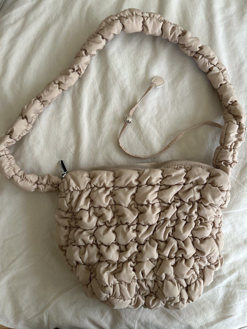 Puffy Cloud Shoulder Bag (Category: Shoulder Bags) located in Makati City. Submitted by leannd (Listing ID 1445845330, Image 1). Description: - Adorable puffy cloud design - Adjustable and puffy strap - Secure zip closure - Soft material with unique textured pattern - Versatile for everyday or evening wear - Spacious enough for your essentials.