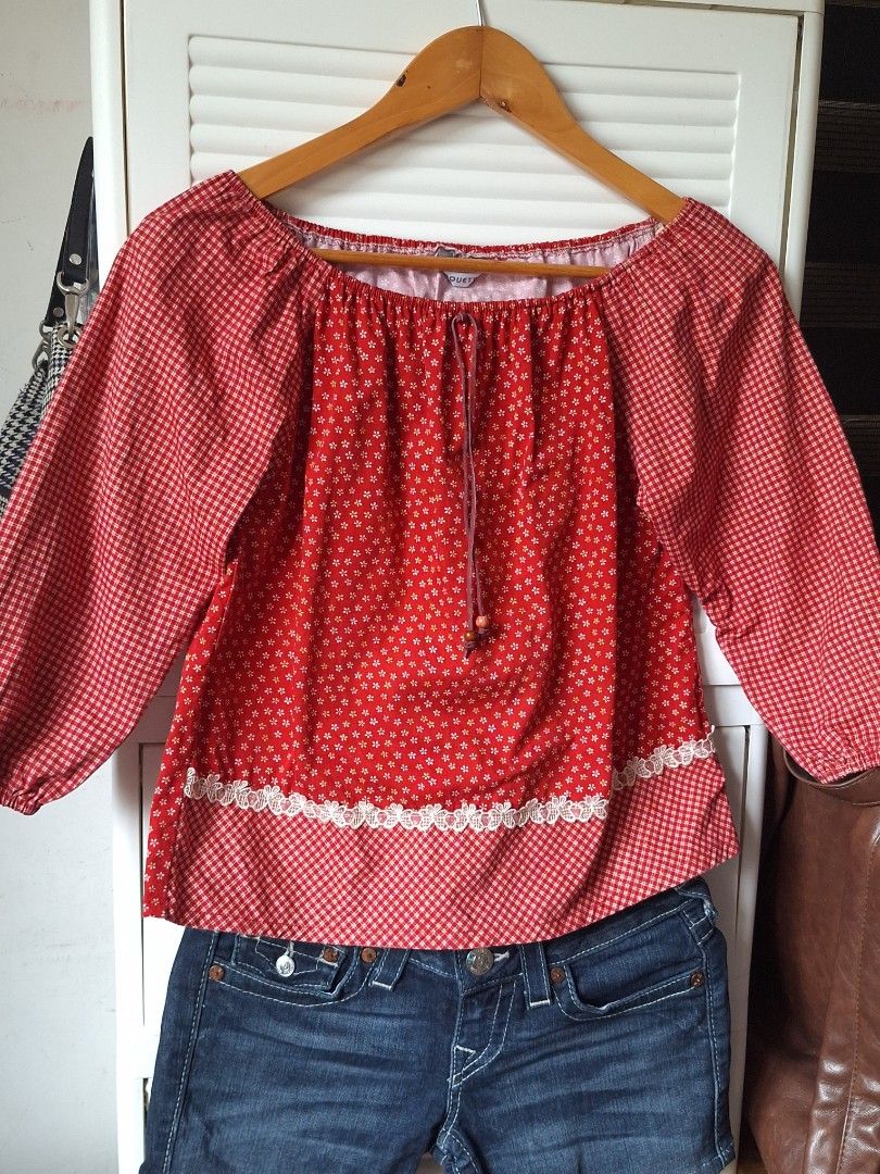 Red Floral Off-Shoulder Top with Gingham Sleeves (Category: Blouses) located in Manila. Submitted by chloe.dc (Listing ID 1445880396, Image 3). Description: DM for inquiries! Size: medium Location: Caloocan ☆ No COD ☆ Manage expectations! Items are preloved/thrifted. ☆ Buyer shoulders shipping fee ☆ MOD is J&T.