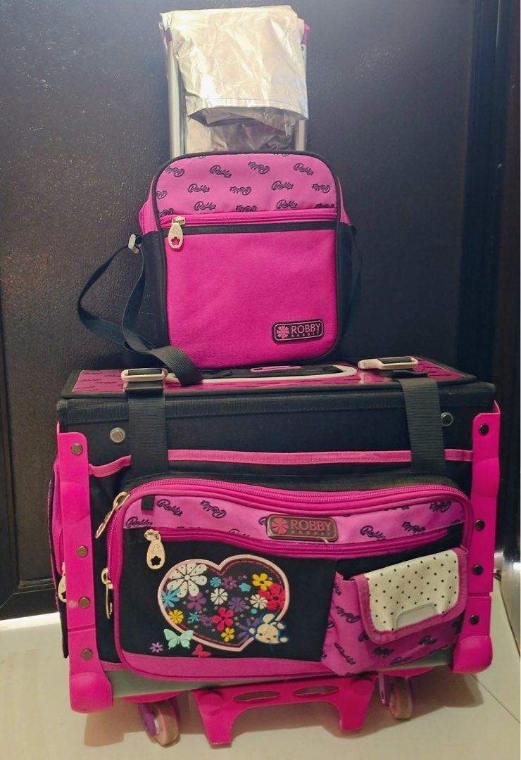 Robby Rabbit Pink Trolley School Bag Set with Accessories (Category: Babies & Kids Fashion) located in Quezon City. Submitted by fearlessorange (Listing ID 1445856937, Image 3). Description: - Slightly used Robby Rabbit trolley bag set - Includes main trolley bag - Matching lunch bag/water bottle carrier - Pencil case - Comes with a rain cover - Reason for selling: No longer needed - Missing water bottle.