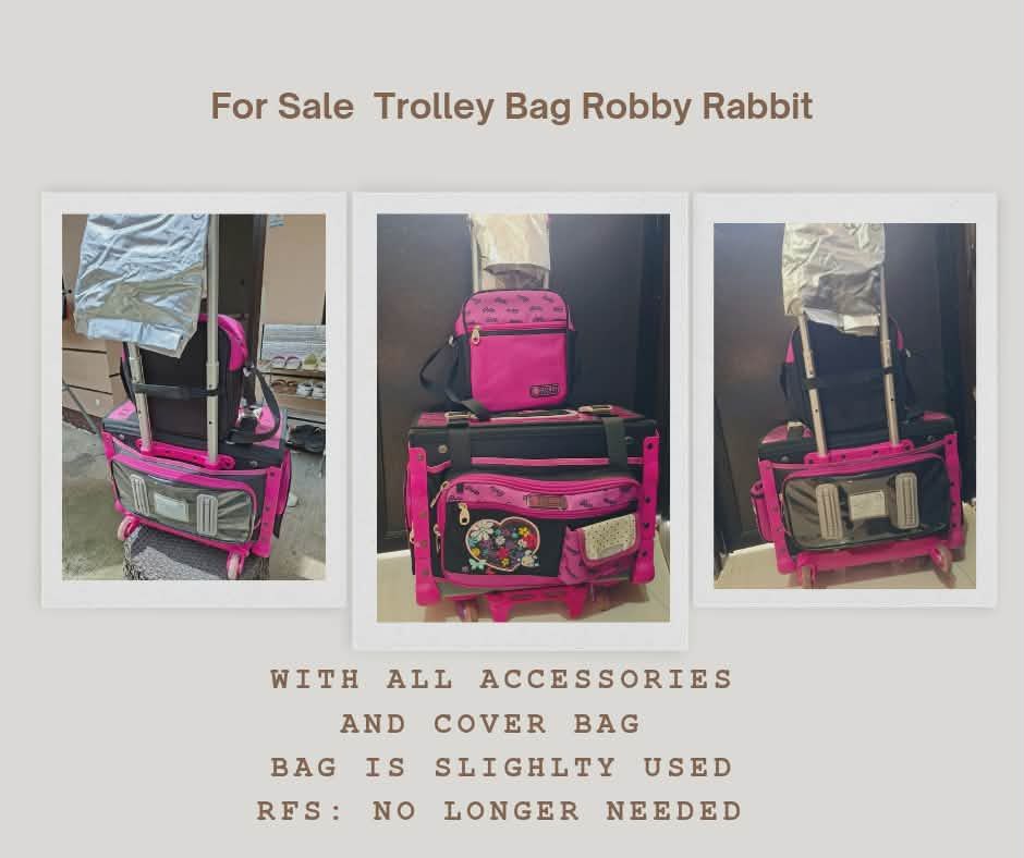Robby Rabbit Pink Trolley School Bag Set with Accessories (Category: Babies & Kids Fashion) located in Quezon City. Submitted by fearlessorange (Listing ID 1445856937, Image 2). Description: - Slightly used Robby Rabbit trolley bag set - Includes main trolley bag - Matching lunch bag/water bottle carrier - Pencil case - Comes with a rain cover - Reason for selling: No longer needed - Missing water bottle.