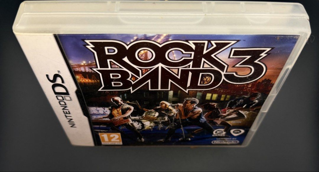 Rock Band 3 Nintendo DS Game (Category: Nintendo) located in Las Pinas. Submitted by cjdmc (Listing ID 1445861832, Image 1). Description: - Rock Band 3 game for Nintendo DS - Includes game cartridge - Instruction booklet included - Original case included - Great for music game enthusiasts.