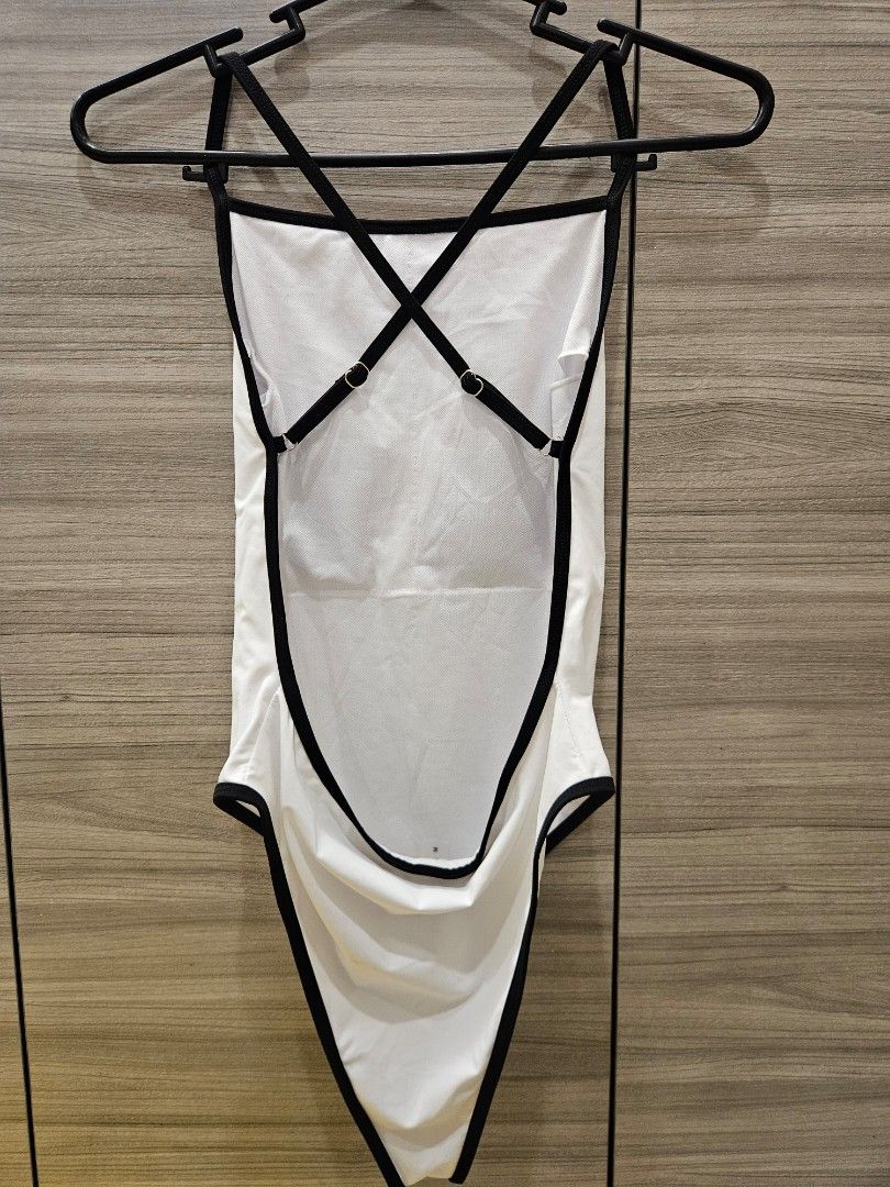 Shein White Swimsuit with Black Trim (Category: Bikinis & Swimsuits) located in San Juan City. Submitted by integrale (Listing ID 1445903903, Image 3). Description: - White one-piece swimsuit - Black trim detail - High-cut leg design - Padded - Size: Medium (M) - Ideal for beach trips and pool days.