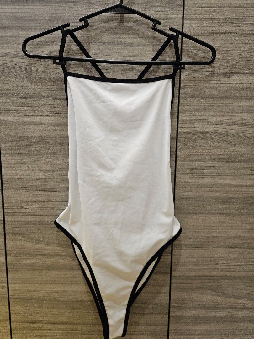 Shein White Swimsuit with Black Trim (Category: Bikinis & Swimsuits) located in San Juan City. Submitted by integrale (Listing ID 1445903903, Image 2). Description: - White one-piece swimsuit - Black trim detail - High-cut leg design - Padded - Size: Medium (M) - Ideal for beach trips and pool days.