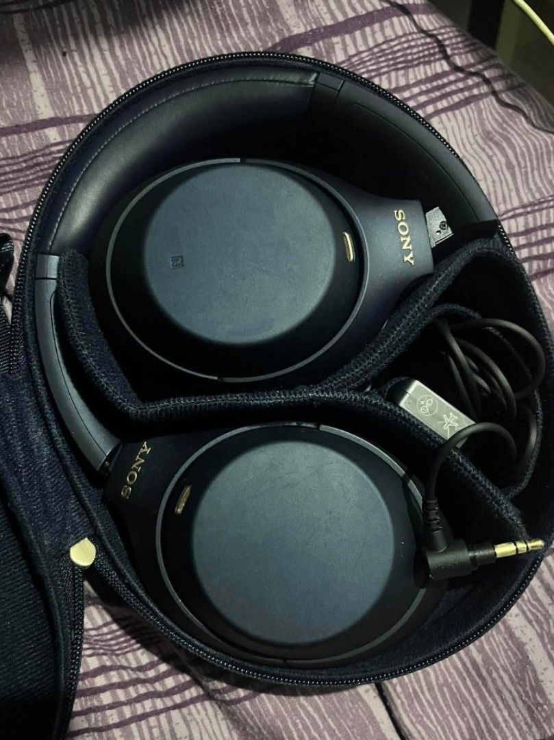 Sony WH-1000XM4/XM4 (Category: Headphones & Headsets) located in Dasmarinas. Submitted by pusspuss97 (Listing ID 1445888043, Image 1). Description: Sony WH-1000XM4 (midnight blue) ~ doesn't come with the box itself ~ rarely used ~ connects with sony | sound connect ~ active noise cancellation working perfectly ~ no issues ~ body cosmetic: 10/10 ~ battery: 10/10 inclusions ~ original carrying case ~ aux cord ~ airplane plug adapter ~ 3.5 mm headph