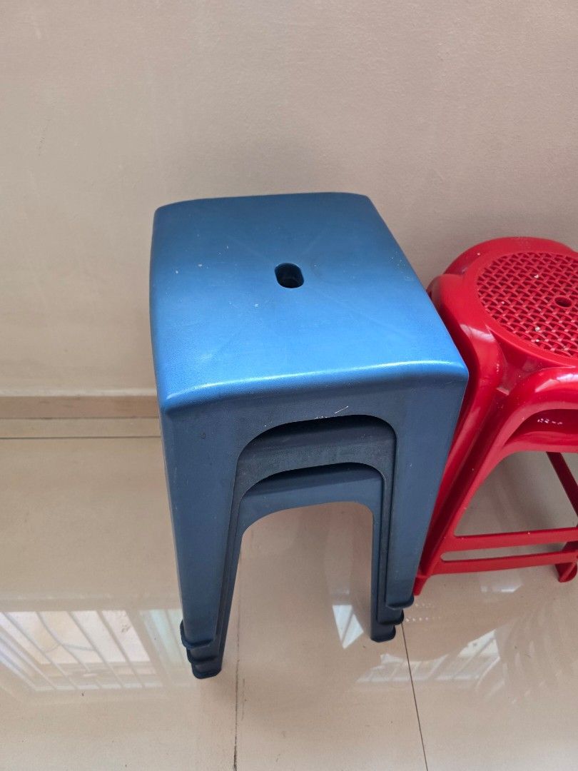 Stackable Plastic Stools (Blue & Red) (Category: Chairs) located in Singapore. Submitted by khvoom (Listing ID 1445859666, Image 2). Description: - Set of 3 stackable plastic stools - Colors: 2 dark blue, 1 bright red - Ideal for extra seating (home or events) - Durable plastic construction - Suitable for indoor and outdoor use - Stacks neatly for convenient storage - Take as per photo condition for all stools.