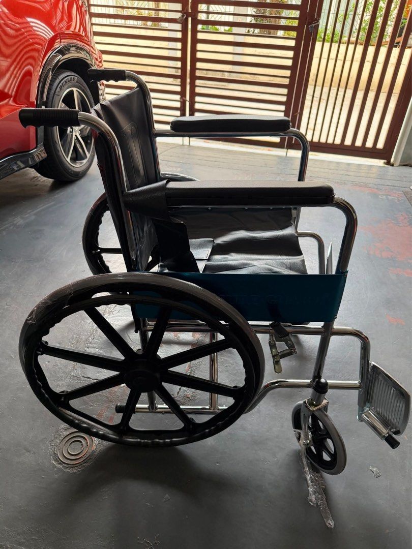 Standard Wheelchair - heavy duty (Category: Wheelchairs) located in Paranaque City. Submitted by criseldagomez (Listing ID 1445838244, Image 2). Description: -Sureguard brand - Standard wheelchair/Heavy duty for mobility assistance - Comfortable blue seat and backrest - Durable chrome frame - Large rear wheels for stability - Smaller front casters for maneuverability - Adjustable footrests for customized comfort - Ready for immediate use -brandne