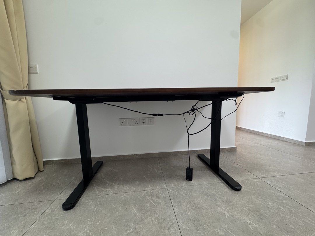 Study Table (Category: Tables & Sets) located in Singapore. Submitted by vnonl (Listing ID 1445852250, Image 2). Description: - wooden table top with round corners - slight stains / scratches as seen - Length 1.6 m, height 0.75 m. - cash and carry Not tested to see if height can be adjusted. As it is. .