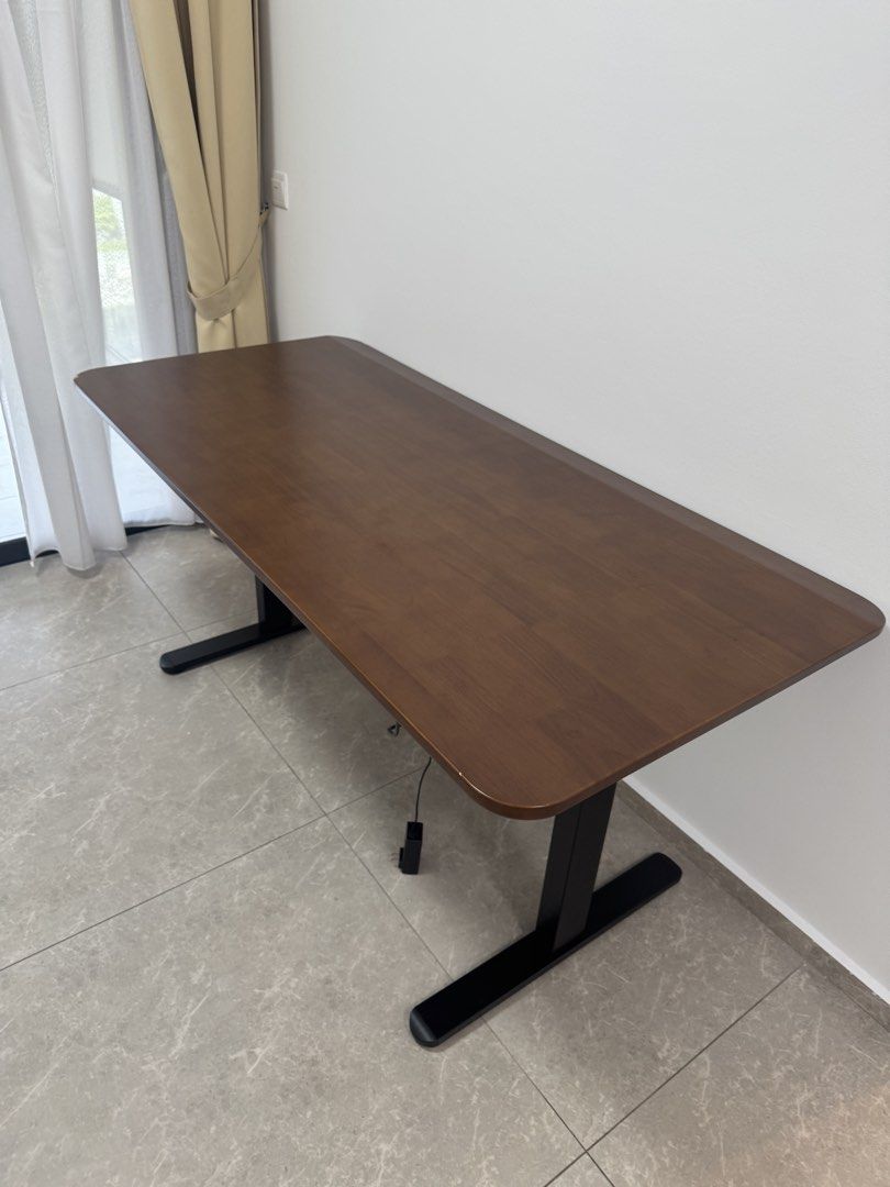 Study Table (Category: Tables & Sets) located in Singapore. Submitted by vnonl (Listing ID 1445852250, Image 1). Description: - wooden table top with round corners - slight stains / scratches as seen - Length 1.6 m, height 0.75 m. - cash and carry Not tested to see if height can be adjusted. As it is. .