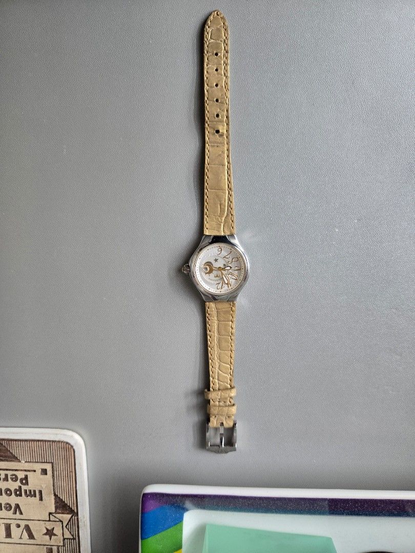 Techno Marine with Moon Phase Dial and Leather Strap (Category: Women's Watches) located in Quezon City. Submitted by mgdeclutters (Listing ID 1445850086, Image 2). Description: - Silver-tone watch - Unique dial with moon phase complication - Arabic numerals and star accents on dial - Light brown, textured leather strap - Buckle closure - Versatile for everyday or special occasions *Needs a strap change.