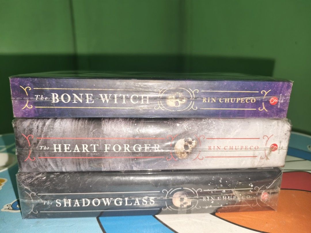 The Bone Witch Trilogy by Rin Chupeco (Category: Storybooks) located in Cavite. Submitted by jannede (Listing ID 1445971842, Image 1). Description: Sold as Set >book 1 The Bone Witch, paperback >book 2 The Heart Forger, hardbound >book 3 The Shadow Glass, hardbound slight tanning and foxing.