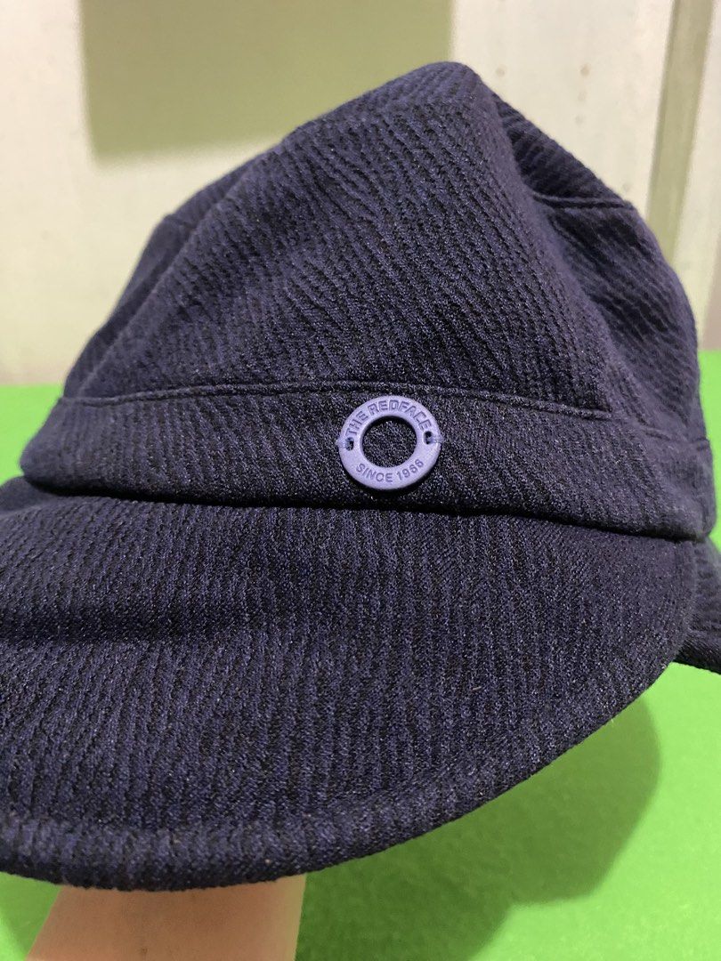 The Redface Since 1966 Bucket Hat Navy Blue (Category: Activewear) located in Manila. Submitted by resi.diaz (Listing ID 1445890899, Image 3). Description: - Navy blue bucket hat from The Redface. - Features a textured fabric. - Small circular detail on the side with 'The Redface Since 1966' inscription. - Classic bucket hat style. - Ideal for sunny days or casual wear..