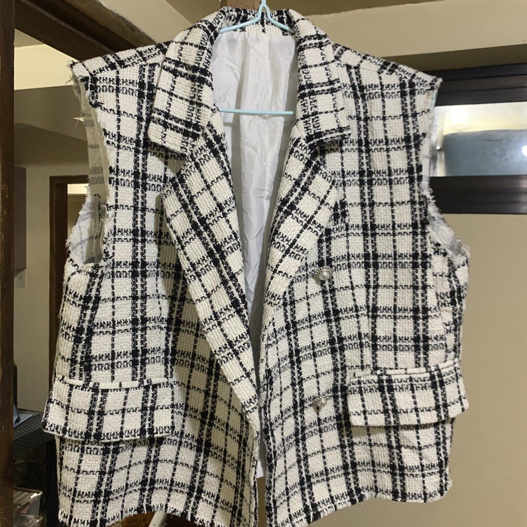 Tweed Plaid Sleeveless Blazer Vest (Category: Sleeveless) located in Itogon. Submitted by kitkayt (Listing ID 1445844715, Image 1). Description: - Classic black and white plaid tweed vest - Stylish double-breasted design - Elegant pearl and silver button details - Trendy raw hem edges on sleeves and bottom - Versatile for layering over tops or dresses - A chic wardrobe essential Preloved Ukay sourced Baguio City DA La Trinidad +TF, payment first 