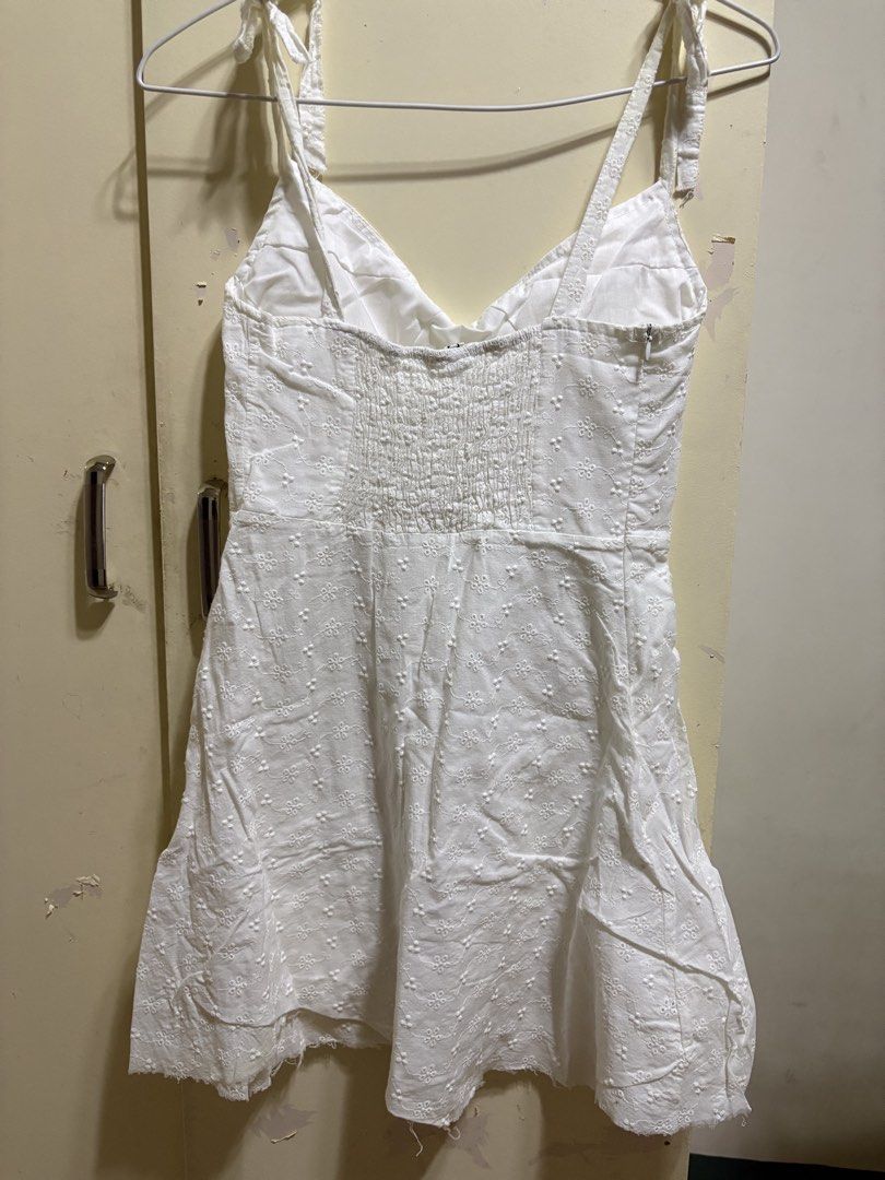 White Eyelet Tie-Strap Mini Flared Dress XS-S (Category: Dresses) located in Solano. Submitted by zaillan (Listing ID 1445968467, Image 2). Description: - Adjustable tie straps on shoulders - Comfortable smocked back - Trendy raw edge hem - Ideal for summer days and beach trips.