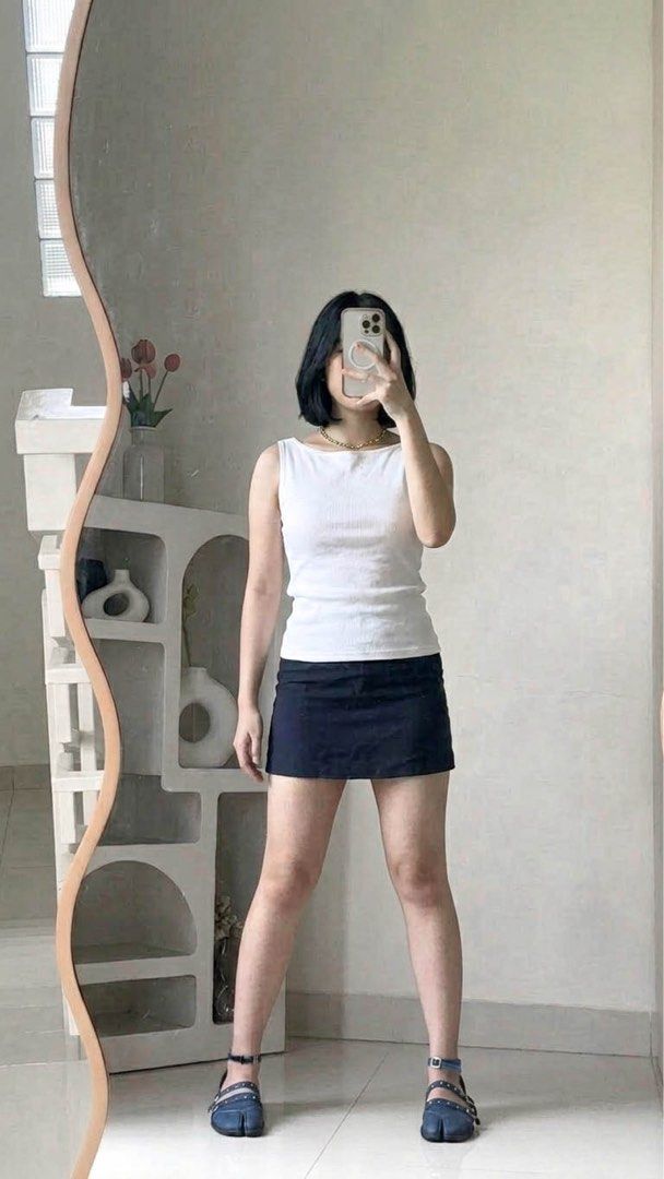 White Ribbed Tank Top (Category: Sleeveless) located in Paranaque City. Submitted by ownbynikki (Listing ID 1445864165, Image 2). Description: - Basic white ribbed tank top.