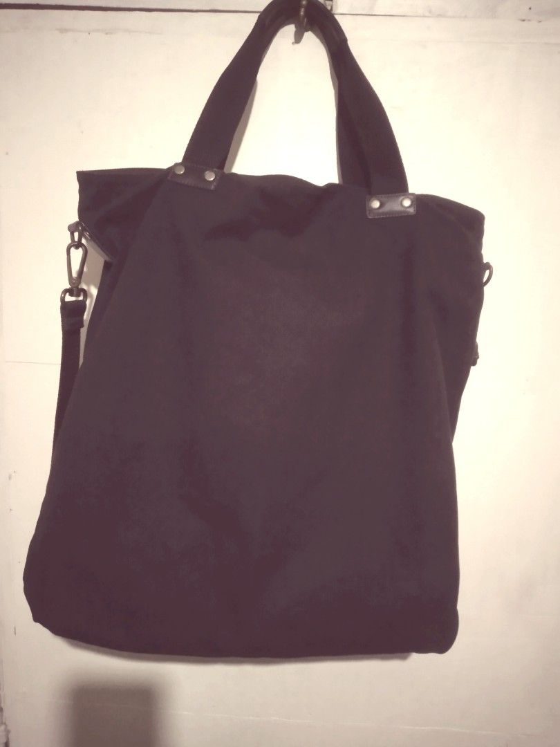 Y-3 Black Toile Shopper (Category: Luxury Bags & Wallets) located in Pasig City. Submitted by aecollection03 (Listing ID 1443502176, Image 2). Description: -From Y3 Collection -Unused-Well kept- Collected. -410×420×70mm - Y-3 black canvas / Leather - Multiple front pockets - Zip-top main compartment - Two top handles - Detachable shoulder strap - Ideal for everyday use or travel - Spacious interior - Filson like canvas.