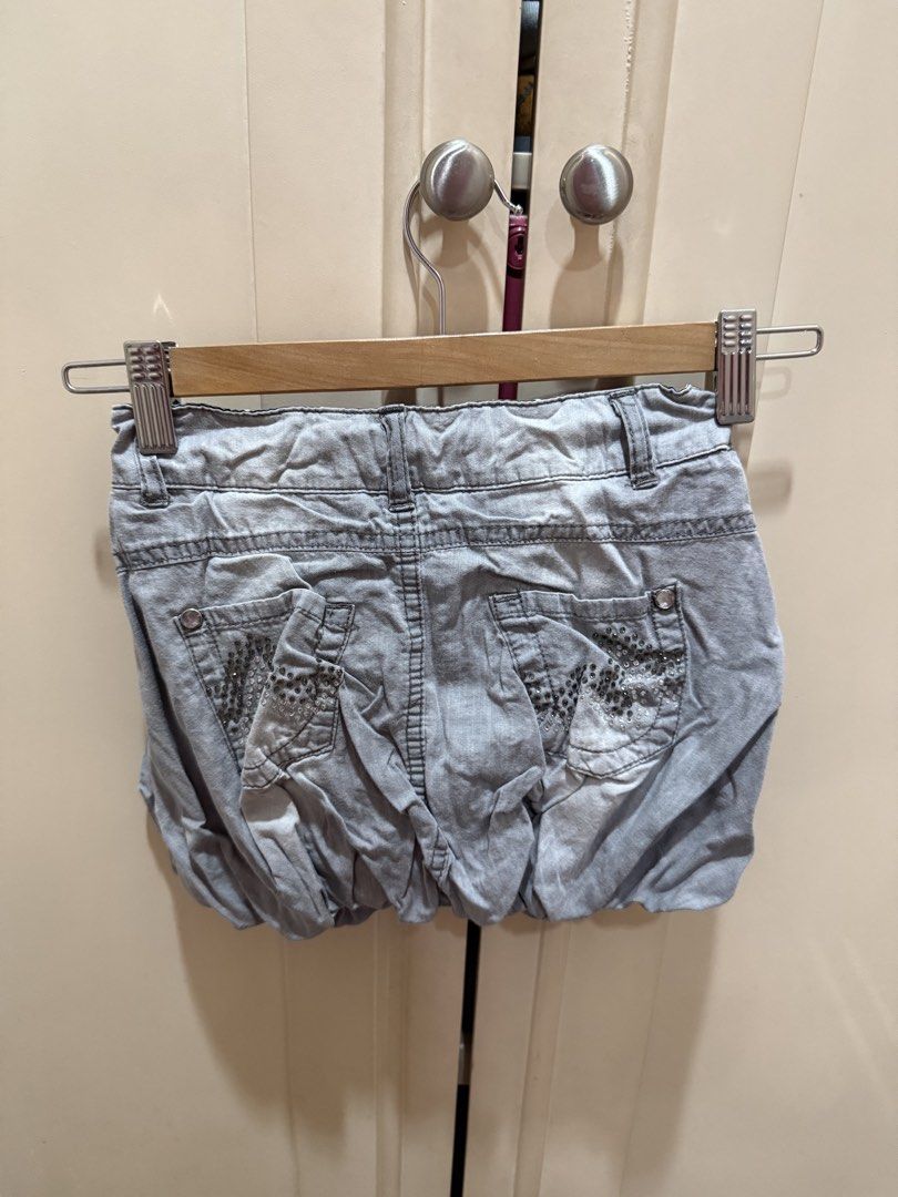 Zara Grey Bubble Skirt with Stud Embellishments (Category: Babies & Kids Fashion) located in Caloocan City. Submitted by oceans18 (Listing ID 1445923545, Image 2). Description: - Grey bubble shorts - Stud details on back pockets - Inner waistband with star pattern - Button and zip front closure - Unique design, perfect for casual wear.