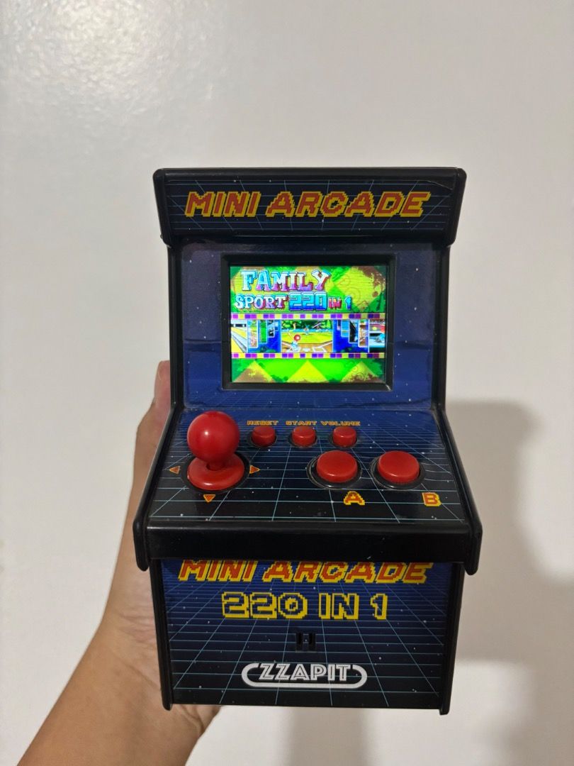 ZZAPIT Mini Arcade 220 in 1 Retro Handheld Game Console (Category: Others) located in Bulacan. Submitted by colin_1819 (Listing ID 1445934839, Image 1). Description: With minimal sign of usage What u see is what u get Battery not included - Mini arcade game with 220 built-in games - Features joystick and buttons for gameplay - Fun retro design with classic arcade graphics - Powered by AA batteries for on-the-go fun - Minor scuffs on bottom corner