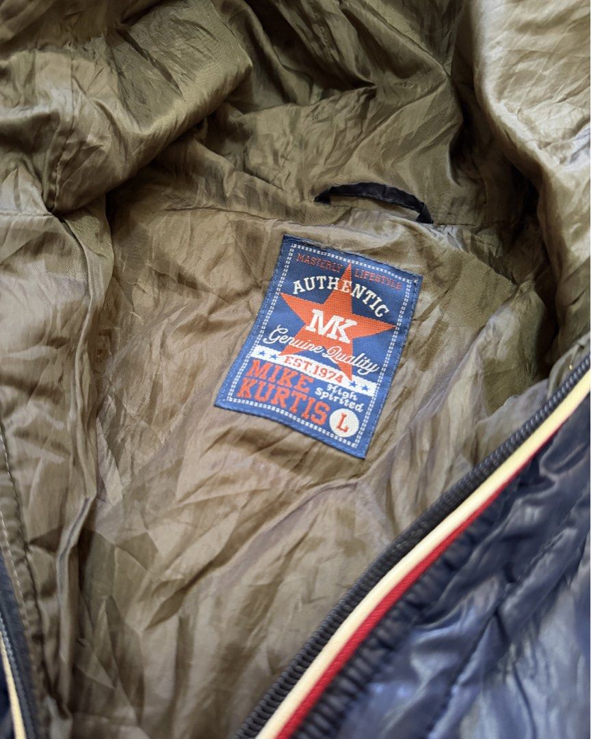 0003 - MIKE KURTIS Hooded Puffer Bomber Jacket (Category: Coats, Jackets and Outerwear) located in Silang. Submitted by ctb.ph (Listing ID 1446094711, Image 3). Description: 🏷️BRAND: Mike Kurtis (Authentic / High Spirited) 🎨COLOR: Deep Navy Blue with khaki inner lining. 📐SIZE & FIT: Large (L) W - 20 Inch L - 28 Inch 💎 CONDITION: Excellent, pre-loved condition. No noticeable stains or tears. All zippers are fully functional. Drawstrings has si