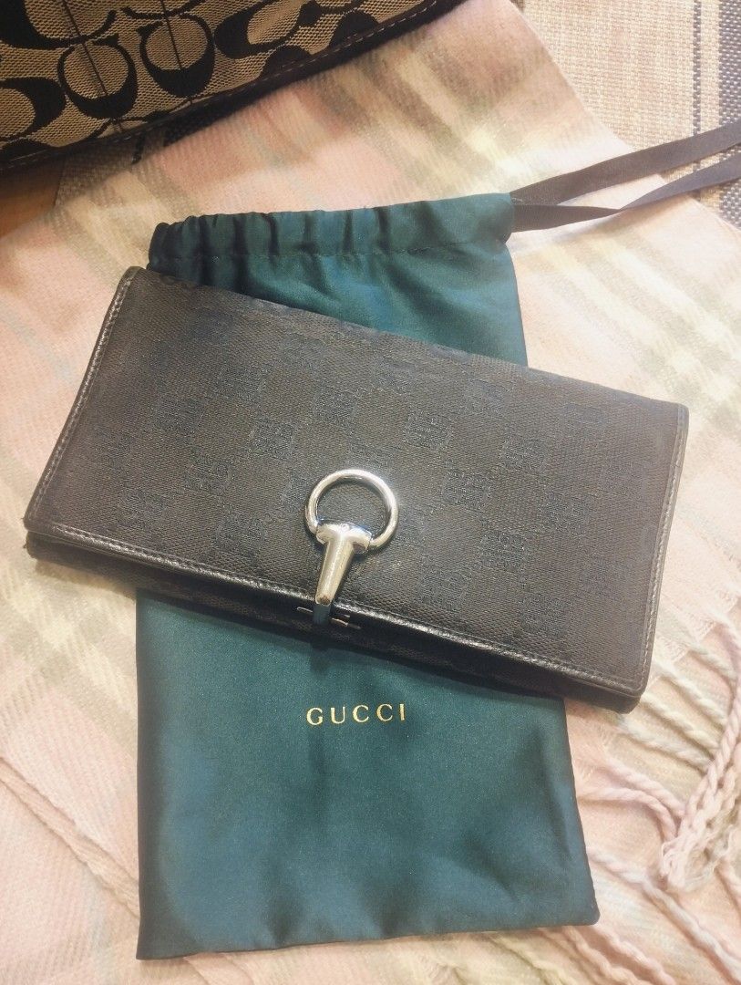 100% Authentic Gucci Continental Wallet (Category: Luxury Bags & Wallets) located in Pasig City. Submitted by ariasaldana (Listing ID 1446025876, Image 1). Description: This is a pre-loved Gucci Black GG canvas horsebit continental wallet in signature jacquard monogram canvas, black leather trim, and iconic silver-tone horsebit ring clasp..