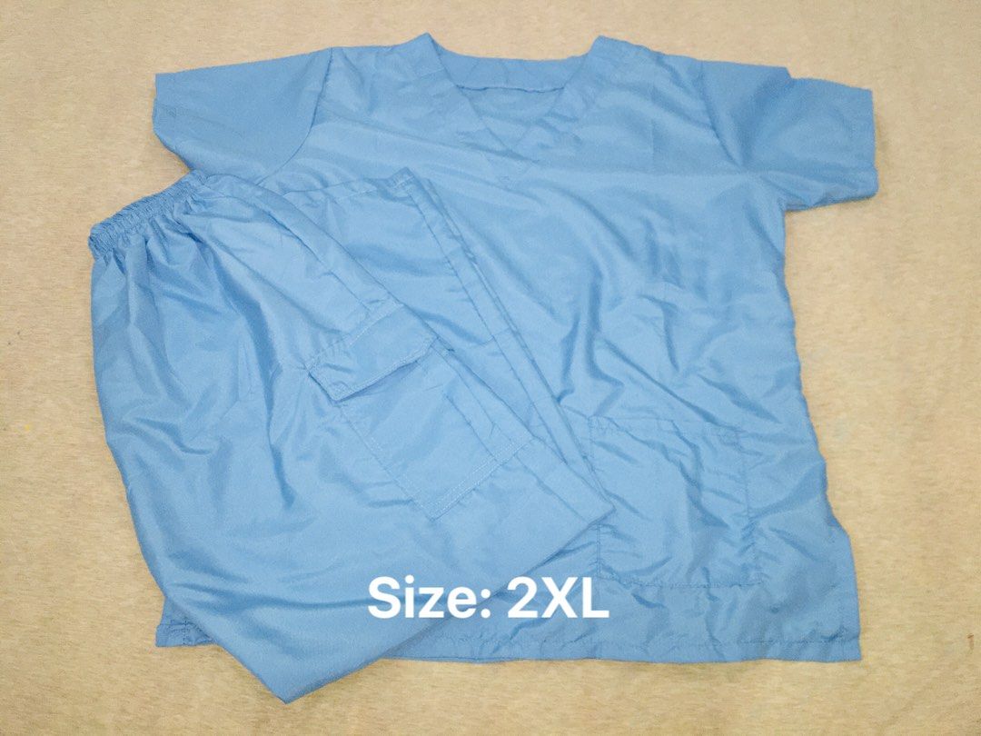 2XL Scrub Suit Set - Medical Uniform (Category: Sets or Coordinates) located in Naic. Submitted by hannahgarcia.014 (Listing ID 1445998475, Image 2). Description: - Set includes: 1 Top & 1 Pants - Size: 2XL - Available Colors: Teal with Navy Trim, Light Blue - Ideal for medical professionals and comfortable workwear..