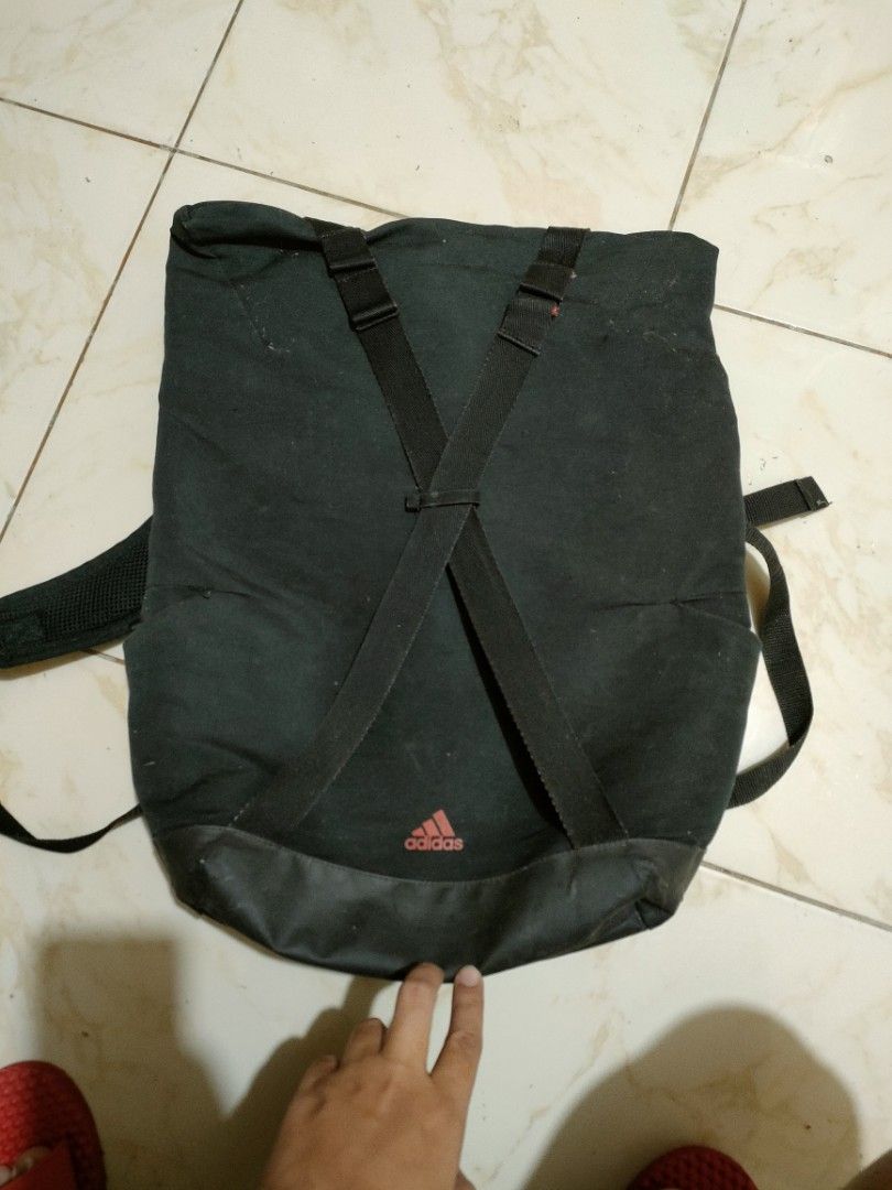 Adidas Black Backpack (Category: Backpacks) located in Caloocan City. Submitted by rjb21 (Listing ID 1446028325, Image 1). Description: - Black Adidas backpack - Adjustable straps - Padded back for comfort - Reinforced bottom for durability - Shows some signs of wear on straps and fabric - Plenty of life left, good for school or everyday use.