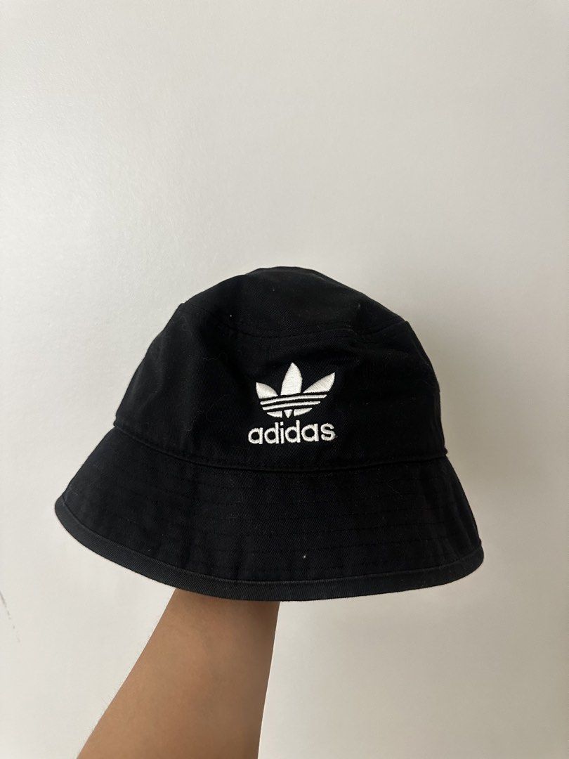 Adidas Bucket Hat Black Trefoil Logo (Category: Hats & Beanies) located in Antipolo. Submitted by sunnysideup323 (Listing ID 1446096982, Image 2). Description: - Classic black Adidas bucket hat - Features iconic embroidered Trefoil logo - One size fits most (OSFM: 57-60cm) - Ideal for sunny weather and adding a sporty vibe Original price: 1,800 RFS: changing style.