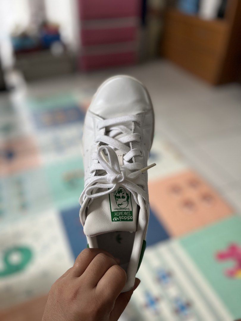 Adidas Stan Smith White Green Leather Sneakers (Category: Sneakers) located in Makati City. Submitted by caeannesee (Listing ID 1446161795, Image 1). Description: - Classic white Adidas Stan Smith sneakers - Iconic green heel tab - Perforated 3-Stripes - Genuine leather upper - White laces - Soles show some wear - Ideal for everyday wear SF shouldered by BUYER good as new barely used .