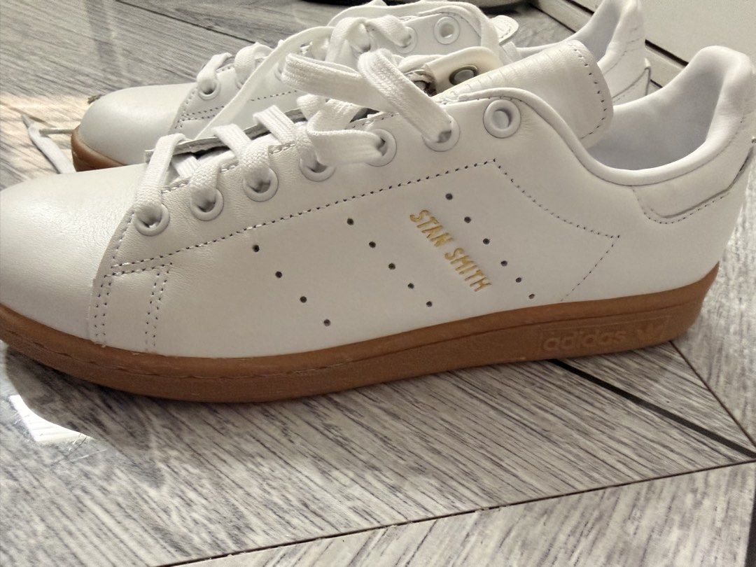 Authentic Adidas Stan Smith White Gum Sole Sneakers (Category: Casual Shoes) located in Makati City. Submitted by churlalee (Listing ID 1445998829, Image 2). Description: - 💯 authentic Classic Adidas Stan Smith sneakers - White leather upper - Gum sole -rfs: decluttering/moving -last price posted, no low ballers pls -grab or lalamove only -manila only - Gold detailing on tongue and heel tab - Timeless and versatile style - Ideal for everyday wea