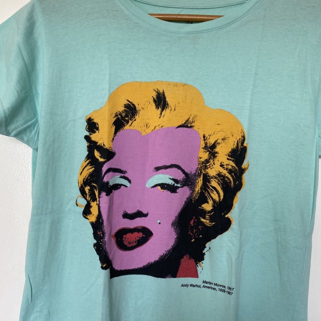Andy Warhol Marilyn Monroe T-Shirt (Category: Shirts) located in Cavite. Submitted by branchee_chic (Listing ID 1446058943, Image 2). Description: 💕S-M 💕Need wash 💕This is UKAY! Please Manage your expectations. Thank you!:) - Aqua blue t-shirt - Features iconic Andy Warhol 'Marilyn Monroe, 1967' print - Soft fabric for ultimate comfort - Comfortable, relaxed fit - Ideal statement piece for art lovers and fans of pop culture.