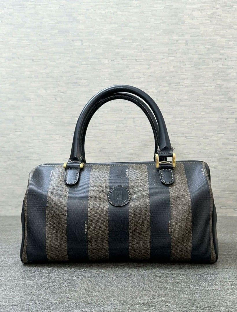 Authentic Fendi Zucca Striped Boston Bag (Category: Luxury Bags & Wallets) located in Bulacan. Submitted by dior_is_love (Listing ID 1445986309, Image 1). Description: - Classic Fendi Boston Bag - Iconic brown and black Zucca stripe pattern - Features top handles - Central Fendi logo plaque - Timeless piece, perfect for everyday use with legit grails certificate.