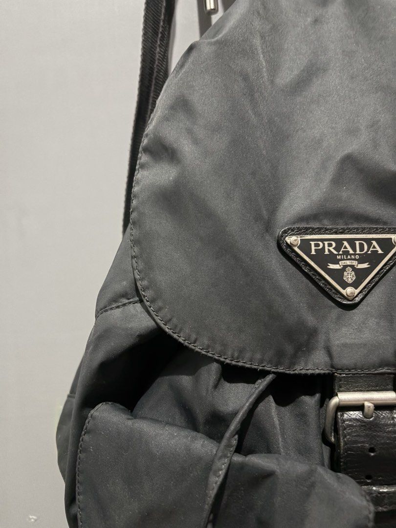 Authentic Vintage Prada Vela Tessuto Nylon Double Pocket Backpack (Black) (Category: Backpacks) located in Makati City. Submitted by lovely.sibug.5953f7 (Listing ID 1445281548, Image 2). Description: Selling an authentic vintage Prada Vela double pocket rucksack in classic Nero (Black). A timeless, lightweight luxury staple that pairs effortlessly with any casual or retro streetwear outfit. Brand: Prada Material: Tessuto Nylon with genuine leathe