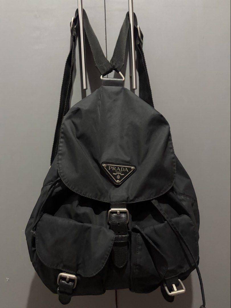 Authentic Vintage Prada Vela Tessuto Nylon Double Pocket Backpack (Black) (Category: Backpacks) located in Makati City. Submitted by lovely.sibug.5953f7 (Listing ID 1445281548, Image 1). Description: Selling an authentic vintage Prada Vela double pocket rucksack in classic Nero (Black). A timeless, lightweight luxury staple that pairs effortlessly with any casual or retro streetwear outfit. Brand: Prada Material: Tessuto Nylon with genuine leathe