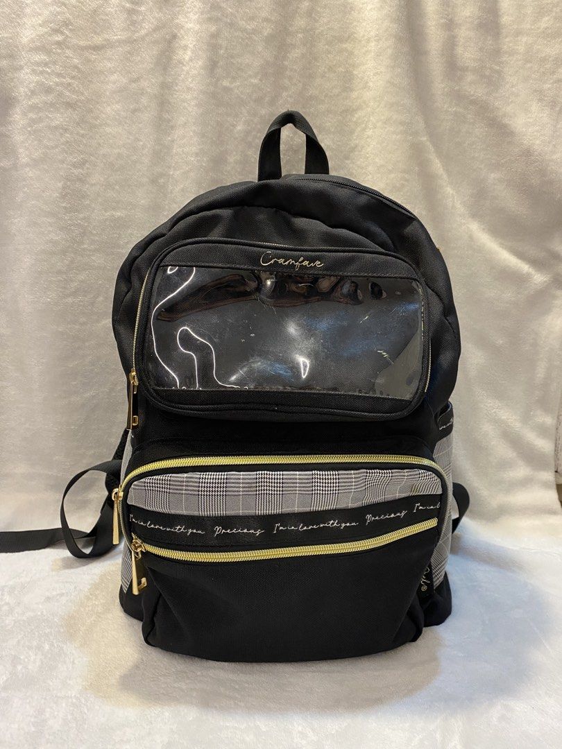 Bagpack from japan! (good for back to school) (Category: Backpacks) located in Binan City. Submitted by prelovedbycass123 (Listing ID 1446076837, Image 1). Description: - Cute black backpack - Features a clear display pocket on the front - Stylish plaid accent - Eye-catching yellow zipper details - Adjustable straps for a comfortable fit - Ideal for everyday use - Perfect for displaying pins, charms, and patches - Plenty of interior space.