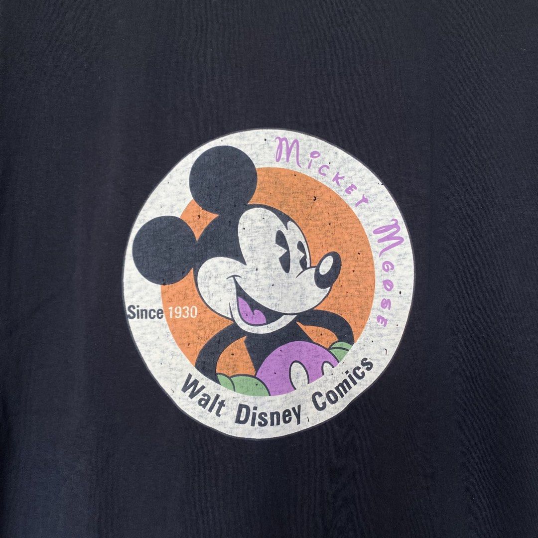 Black Mickey Mouse Walt Disney Comics T-Shirt (Category: Shirts) located in Cavite. Submitted by branchee_chic (Listing ID 1446062045, Image 2). Description: 💕M-L 💕Need wash 💕This is UKAY! Please Manage your expectations. Thank you!:) - Classic black t-shirt - Features a vintage Mickey Mouse graphic - Graphic text: 'Mickey Mouse Since 1930 Walt Disney Comics' - Ideal for Disney enthusiasts - Comfortable and casual design - Suitable for everyda