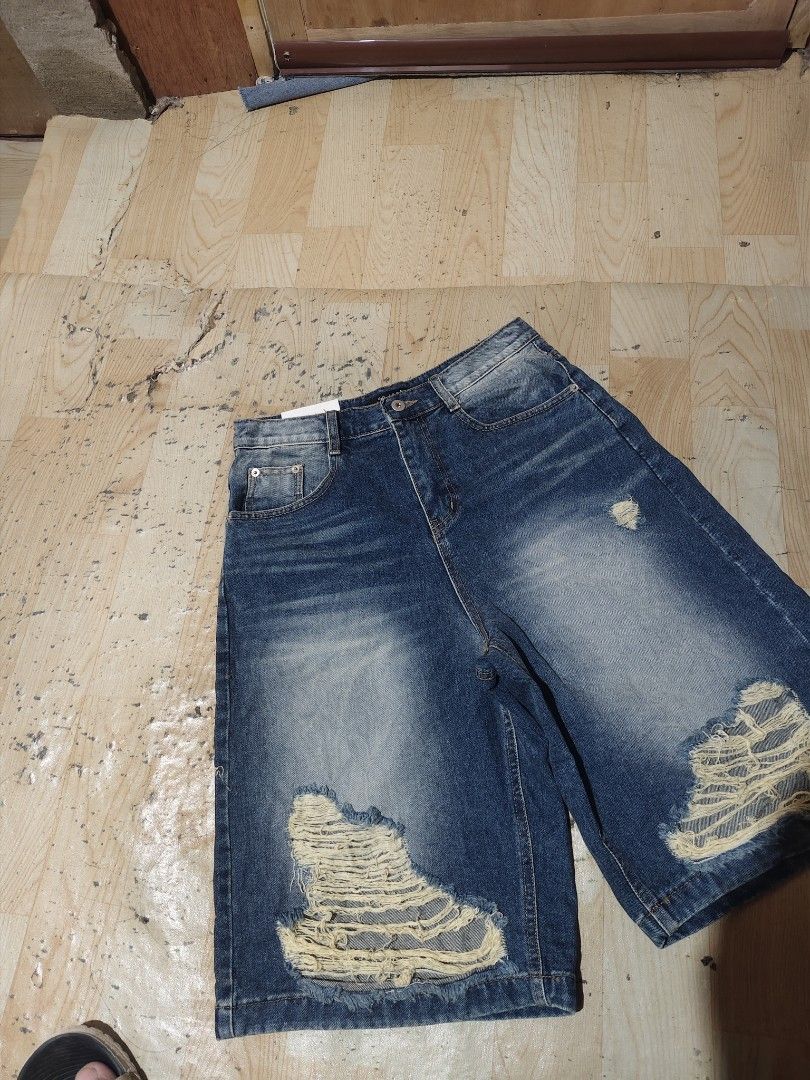 Blue Distressed Ripped Denim Shorts (Category: Shorts) located in Davao. Submitted by thriftforus (Listing ID 1446068361, Image 3). Description: - Cool blue denim shorts - Ripped details on the front -Waist 28-30 length 24 thigh 14 - Mid-thigh length - Button and zip closure - Front and back pockets - Ideal for casual wear.