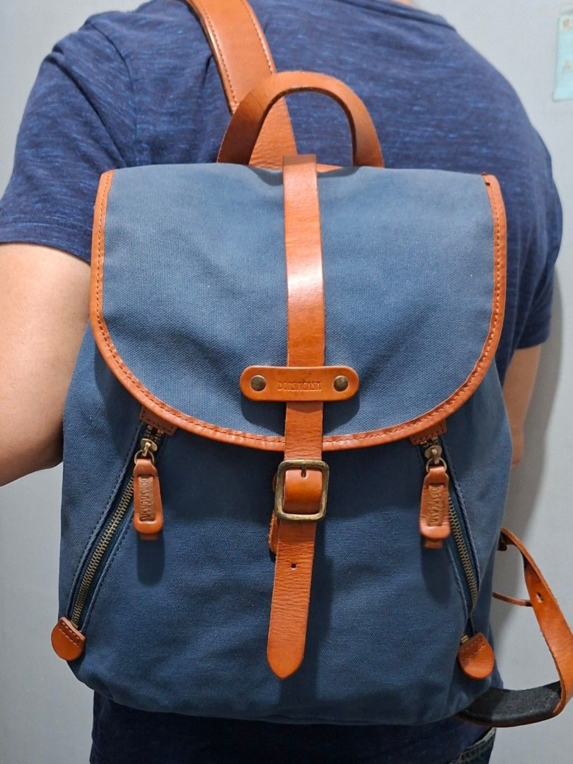 BorsaCasa Canvas Leather Backpack Made in Japan (Category: Backpacks) located in Quezon City. Submitted by moonthrifting (Listing ID 1446120870, Image 1). Description: - Stylish blue canvas backpack with premium brown leather accents. - Secure buckle closure and convenient zip pockets. - Crafted in Japan by Borsa a Casa, known for quality. - Made with high-quality leather for durability. - Ideal for everyday use, combining style and function..