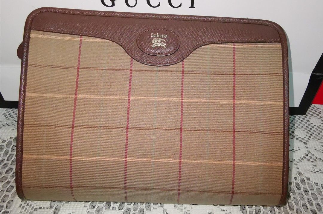 Burberry Clutch Bag (Category: Luxury Bags & Wallets) located in Angeles City. Submitted by jcshomefinds (Listing ID 1446062195, Image 1). Description: BURBERRY NOVA CHECK CLUTCH BAG On hand Authentic/Original Canvas beige Secure zipper closure Interior slip pocket for organization Approximate dimensions: 11 inches (length) x 8 inches (height) Very good condition Entrupy Certified 💁‍♀️Trusted trader since 2017 🏦BPI / Gcash.