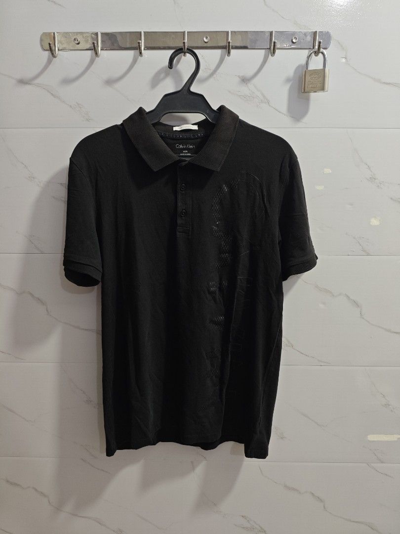 Calvin Klein Black Stretch Unisex Tshirt (Category: Tshirts & Polo Shirts ) located in Baguio. Submitted by cool_chic (Listing ID 1446036852, Image 1). Description: Calvin Klein Stretch Fit Unisex Polo Shirt Color Rate 9.5/10 No Flaws Complete Tags Rubberized Logo Stretchy Tela Machine Washed Size Medium Dimes 20 Width 27 Length Price P299.