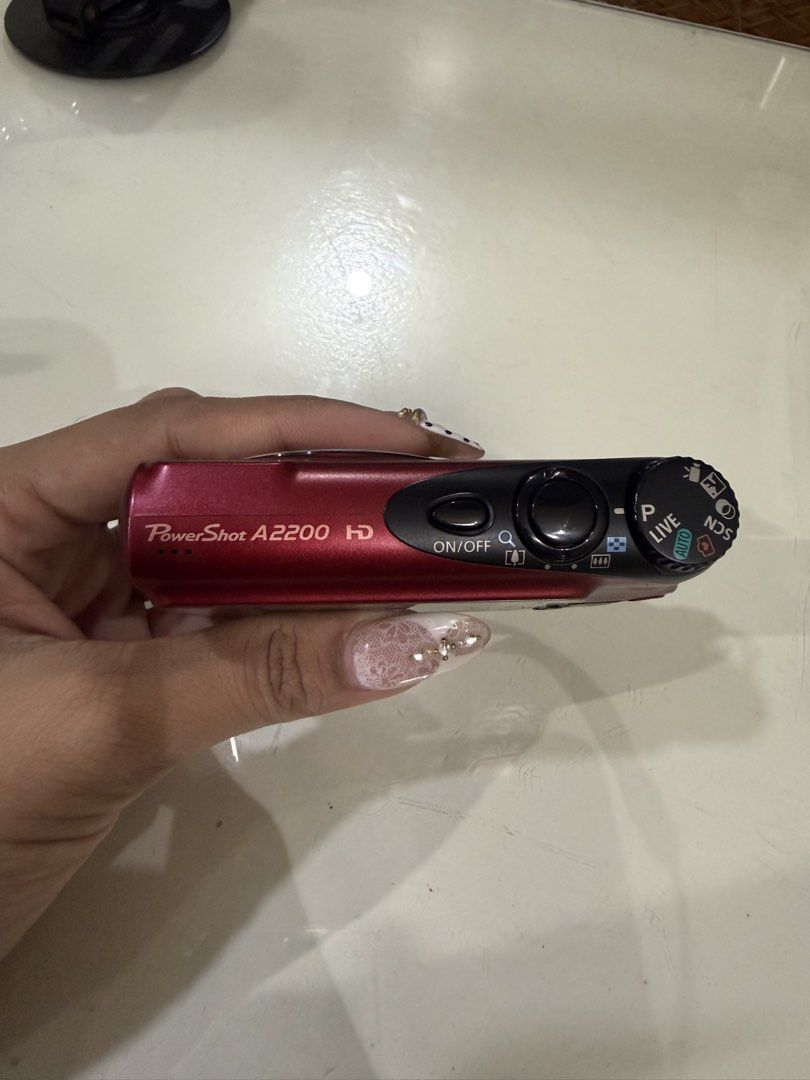 Canon Powershot A2200 HD (Category: Cameras) located in Santa Rosa. Submitted by ashleyyadao.forest (Listing ID 1446023850, Image 3). Description: canon powershot a2200 (preloved red) *14.1 effective megapixels, 1/2.3-inch CCD image sensor; *4x wide optical zoom and 4x digital zoom *2.7 in. TFT LCD with wide viewing angle; *Built-in flash; 720p HD video DIGIC 4 Image Processor; *Discreet Mode disables sound, flash and AF beam Smart Auto (32 scene