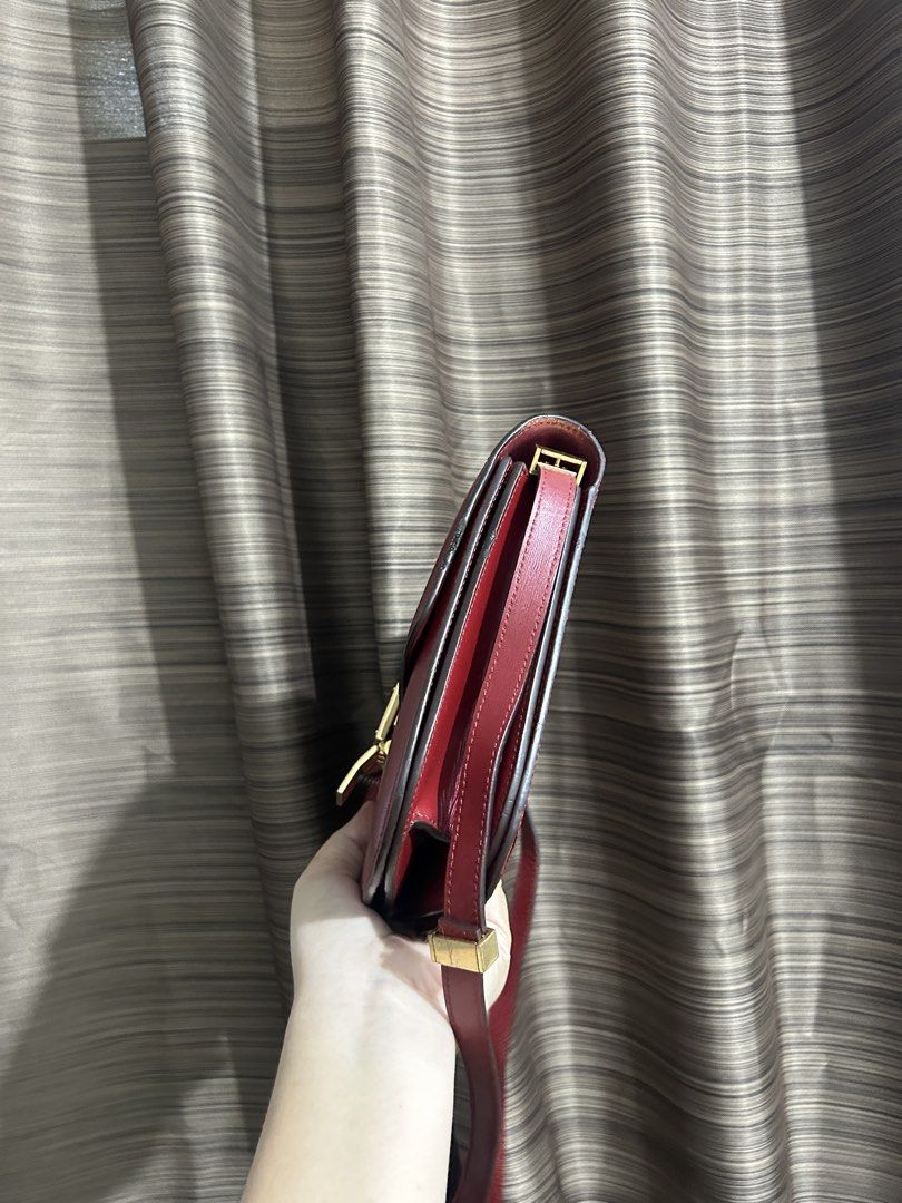 Celine Red Leather Box Bag (Category: Luxury Bags & Wallets) located in Tacloban City. Submitted by houseofluxury.co (Listing ID 1446086892, Image 3). Description: - Classic red leather Celine bag - Iconic gold clasp closure - Smooth leather finish - Adjustable shoulder strap - Versatile for day or night use - A timeless addition to any collection.