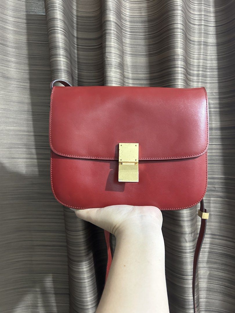 Celine Red Leather Box Bag (Category: Luxury Bags & Wallets) located in Tacloban City. Submitted by houseofluxury.co (Listing ID 1446086892, Image 1). Description: - Classic red leather Celine bag - Iconic gold clasp closure - Smooth leather finish - Adjustable shoulder strap - Versatile for day or night use - A timeless addition to any collection.