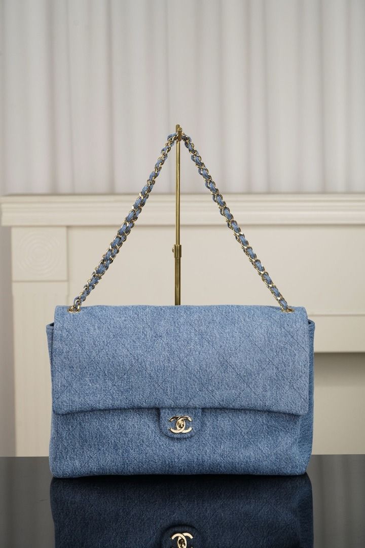 Chanel Denim Classic Flap Bag (Category: Luxury Bags & Wallets) located in Muntinlupa City. Submitted by fuzetarhub95690 (Listing ID 1446044710, Image 1). Description: - Classic Chanel flap bag - Material: Light blue denim - Iconic quilted pattern - Gold chain strap - CC logo on front clasp - Back slip pocket - Versatile for everyday or special occasions - Timeless piece.