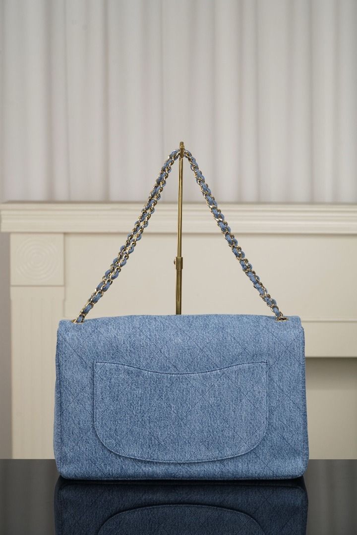 Chanel Denim Classic Flap Bag (Category: Luxury Bags & Wallets) located in Muntinlupa City. Submitted by fuzetarhub95690 (Listing ID 1446044710, Image 2). Description: - Classic Chanel flap bag - Material: Light blue denim - Iconic quilted pattern - Gold chain strap - CC logo on front clasp - Back slip pocket - Versatile for everyday or special occasions - Timeless piece.