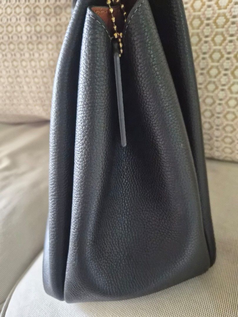Coach Lana Shoulder Bag (Category: Luxury Bags & Wallets) located in Manila. Submitted by fasyon (Listing ID 1446008955, Image 3). Description: Authentic. Purchased at Powerplant mall in June 2025 Complete with dust bag, care card, and Coach paper bag. Slightly used with minimal signs of wear from normal use. Well maintained and still in excellent condition..