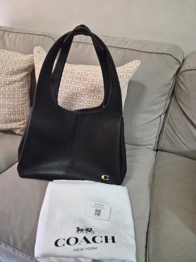 Coach Lana Shoulder Bag (Category: Luxury Bags & Wallets) located in Manila. Submitted by fasyon (Listing ID 1446008955, Image 1). Description: Authentic. Purchased at Powerplant mall in June 2025 Complete with dust bag, care card, and Coach paper bag. Slightly used with minimal signs of wear from normal use. Well maintained and still in excellent condition..