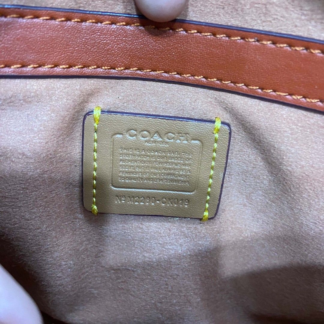 Coach Signature Canvas & Leather Saddle Bag (Category: Luxury Bags & Wallets) located in Bacolod City. Submitted by capitalismgoods6100 (Listing ID 1446036867, Image 2). Description: - Authentic Coach saddle bag - Signature canvas and leather material - Iconic C logo hardware - Adjustable strap for crossbody or shoulder wear - Interior Coach creed and 'made in Vietnam' tag - Ideal for everyday use.